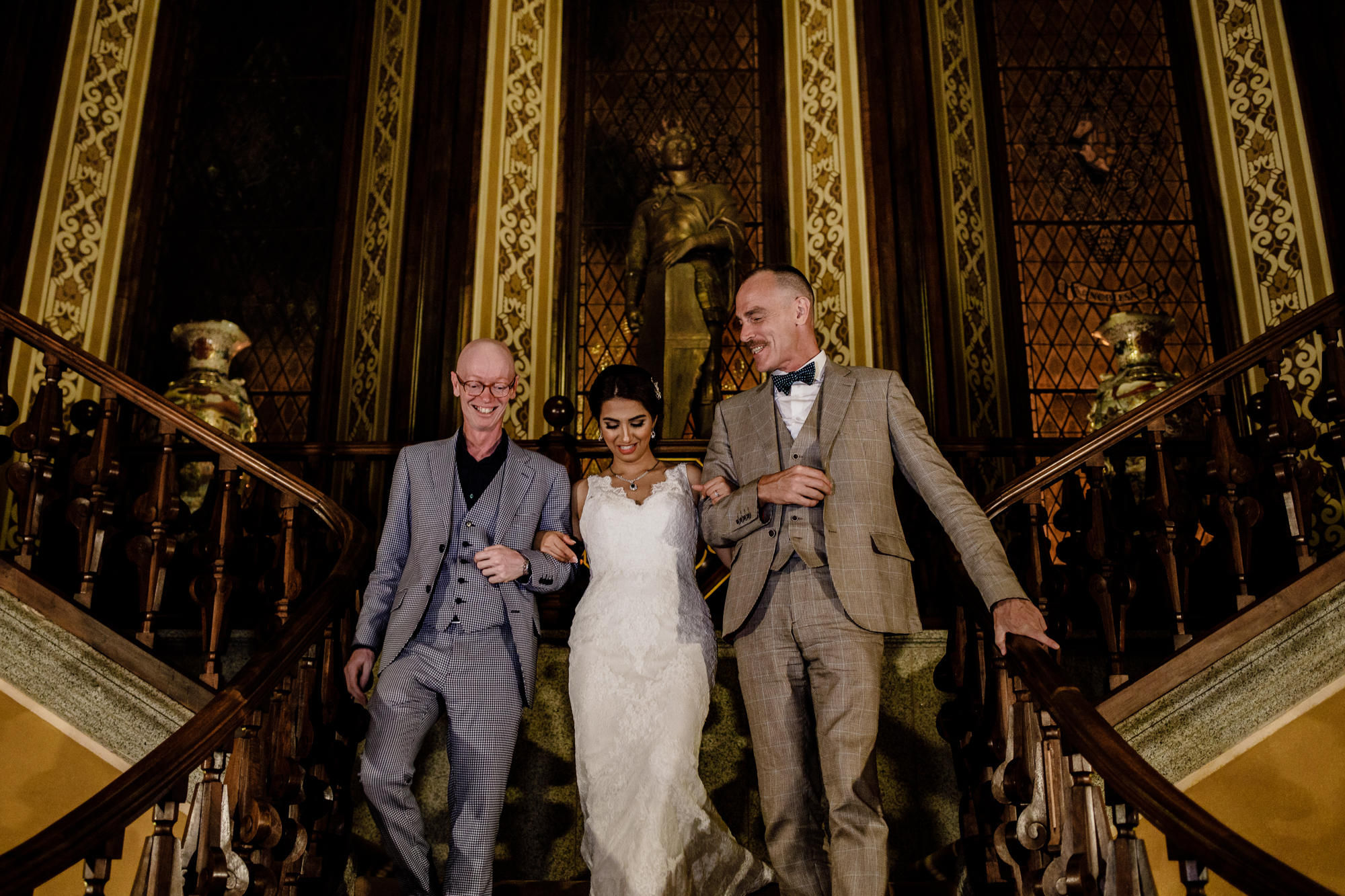 Adam and Salvador walk a bride down the grand staircase of a Barcelona palace venue