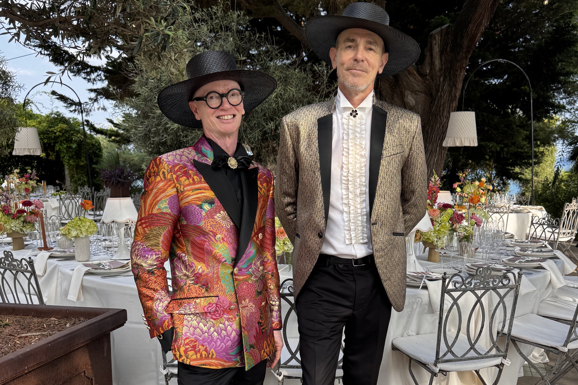 Adam and Salvador Adam Mason and Salvador Costa of Costa & Mason at a Barcelona wedding venue, in evening jackets and black hats